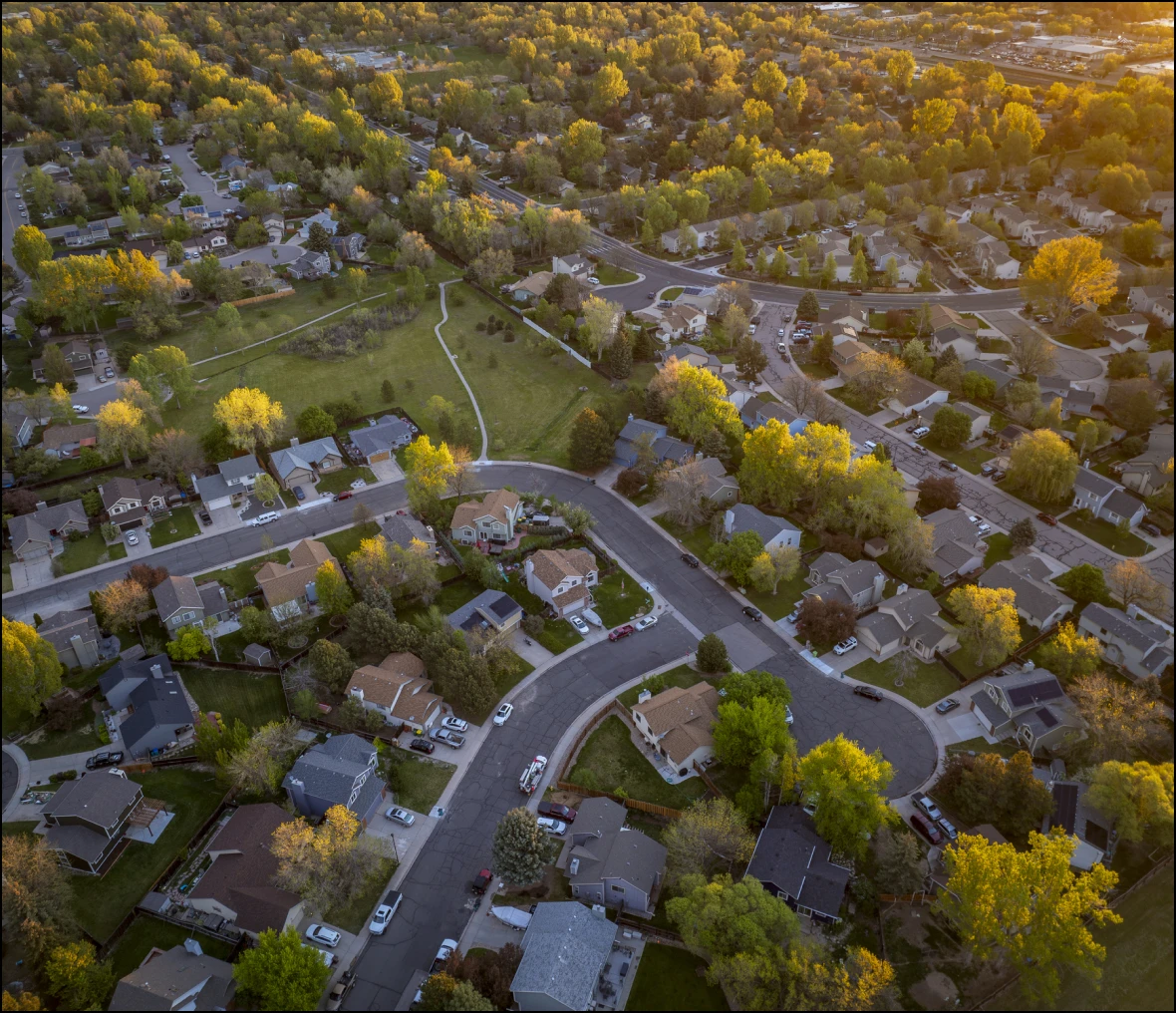 Suburban neighborhood aerial view at sunset